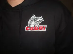 Wit rood Cobri borstlogo